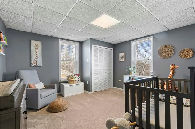 a bedroom with furniture and a window