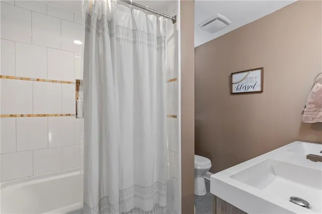 a bathroom with a sink mirror and vanity