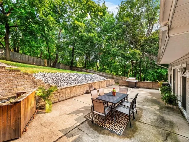 a view of a backyard with sitting area and furniture