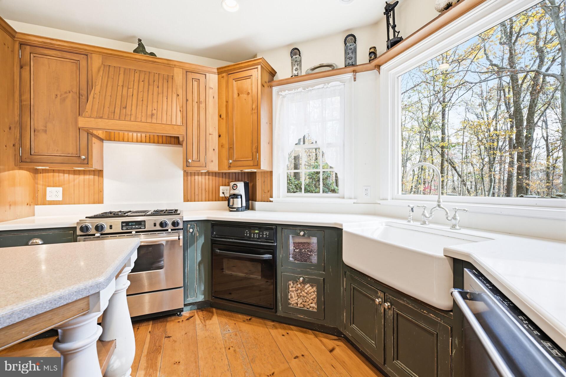 6950 Upper York Road New Hope, PA 18938 - Photo 15 of 60 a kitchen with stainless steel appliances granite countertop a sink stove and refrigerator