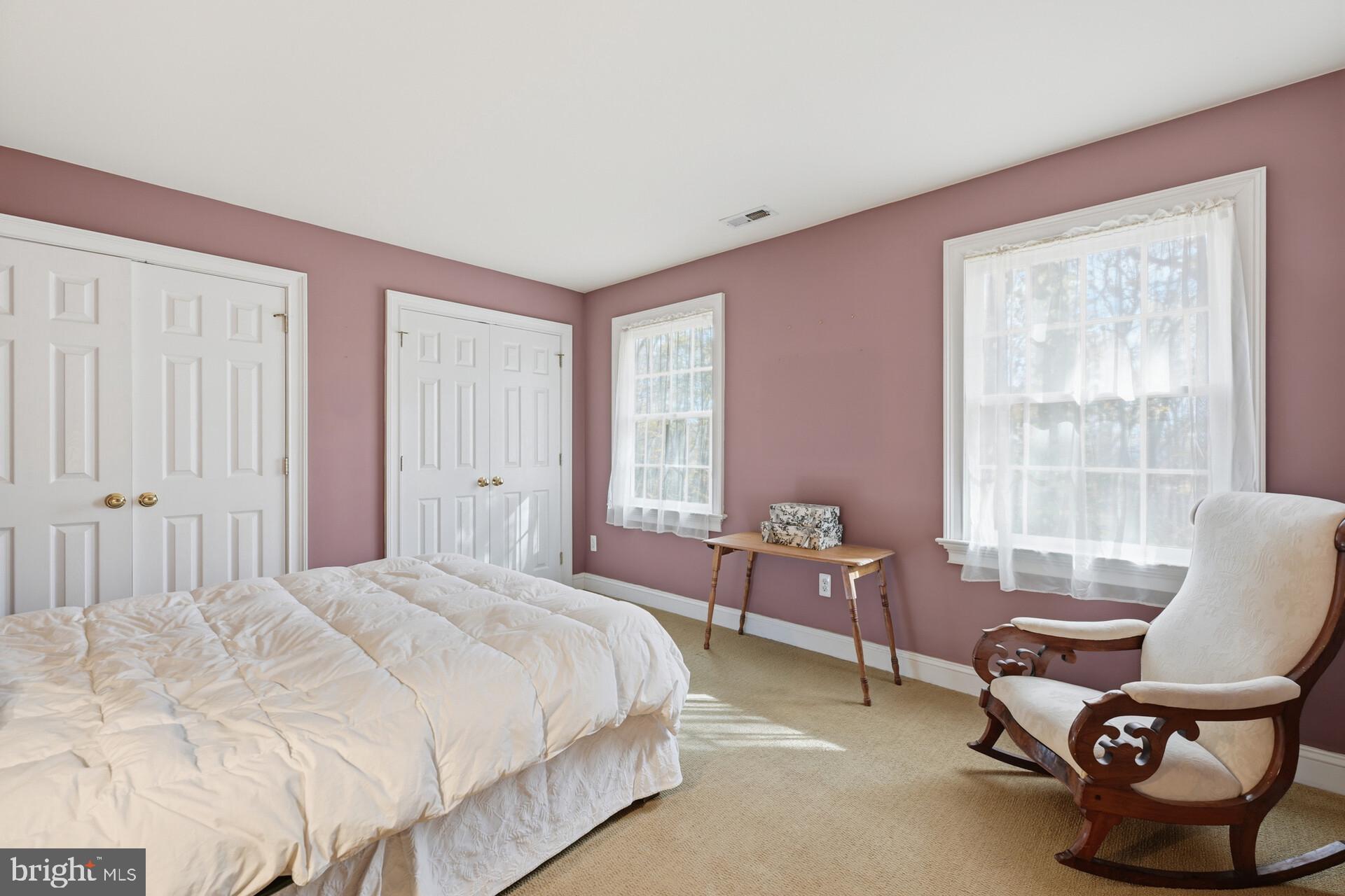 6950 Upper York Road New Hope, PA 18938 - Photo 32 of 60 a bedroom with a bed chair and window