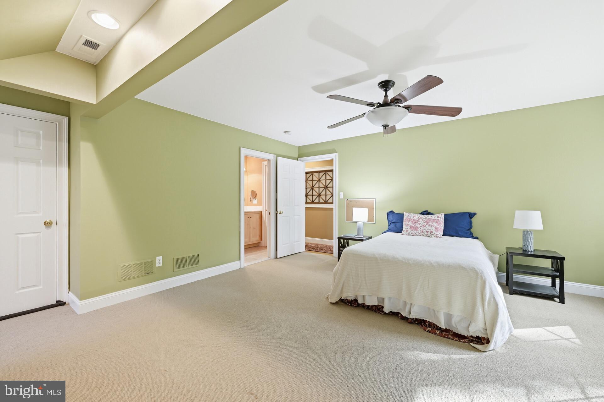6950 Upper York Road New Hope, PA 18938 - Photo 34 of 60 a bedroom with a bed and a ceiling fan