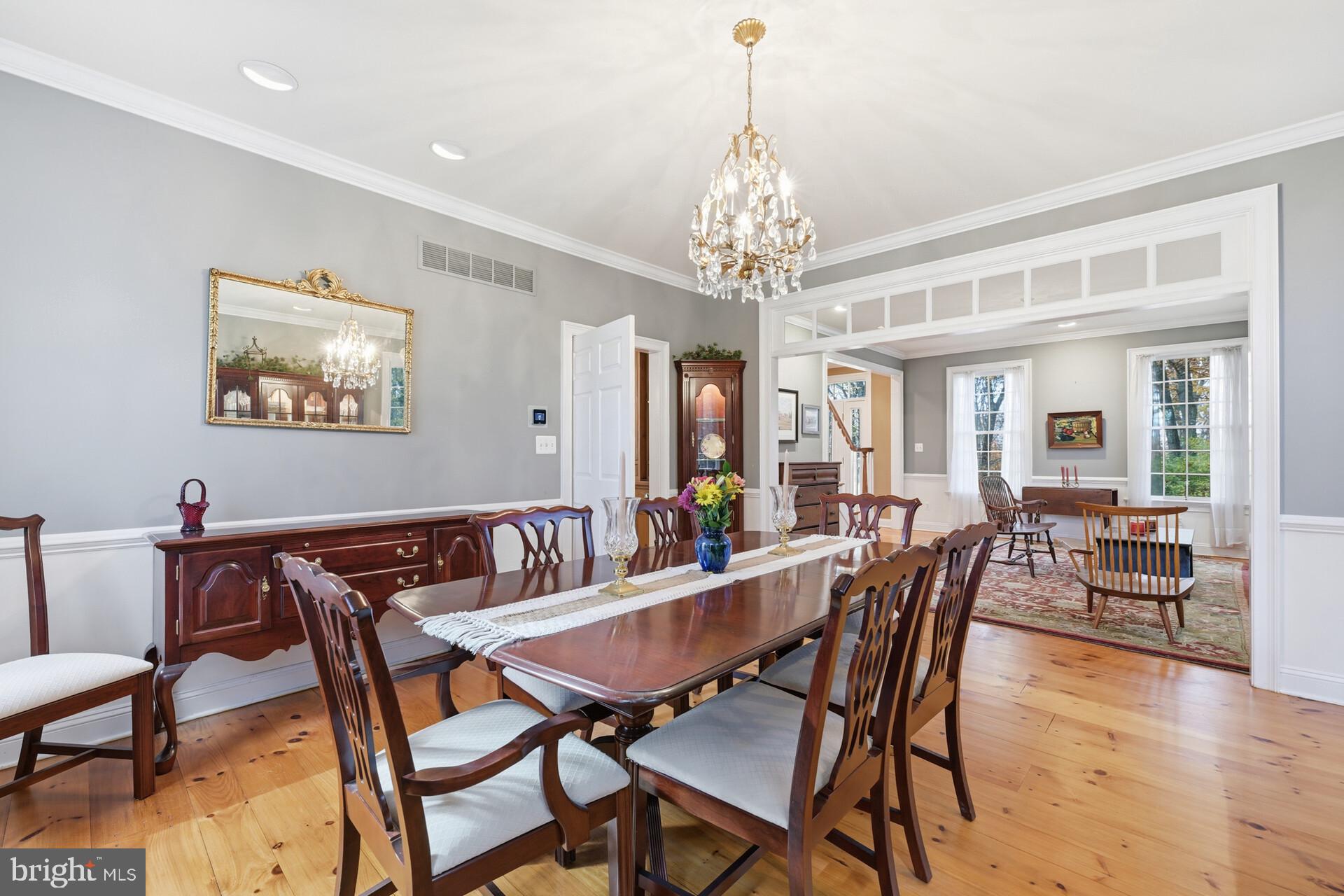 6950 Upper York Road New Hope, PA 18938 - Photo 10 of 60 a view of a dining room with furniture wooden floor and chandelier