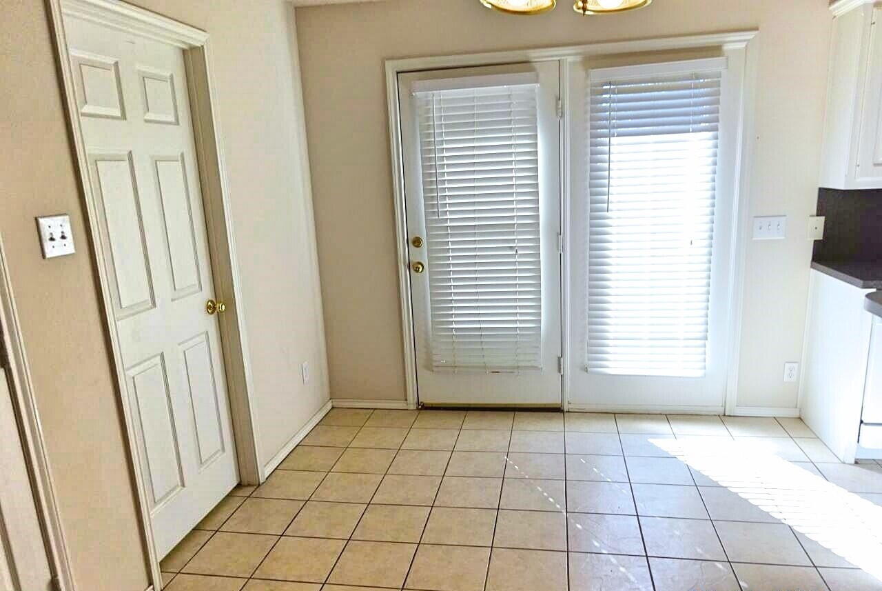 10108 Evanston Avenue, Unit 2 Lubbock, TX 79424 - Photo 4 of 8 a view of an empty room with a window