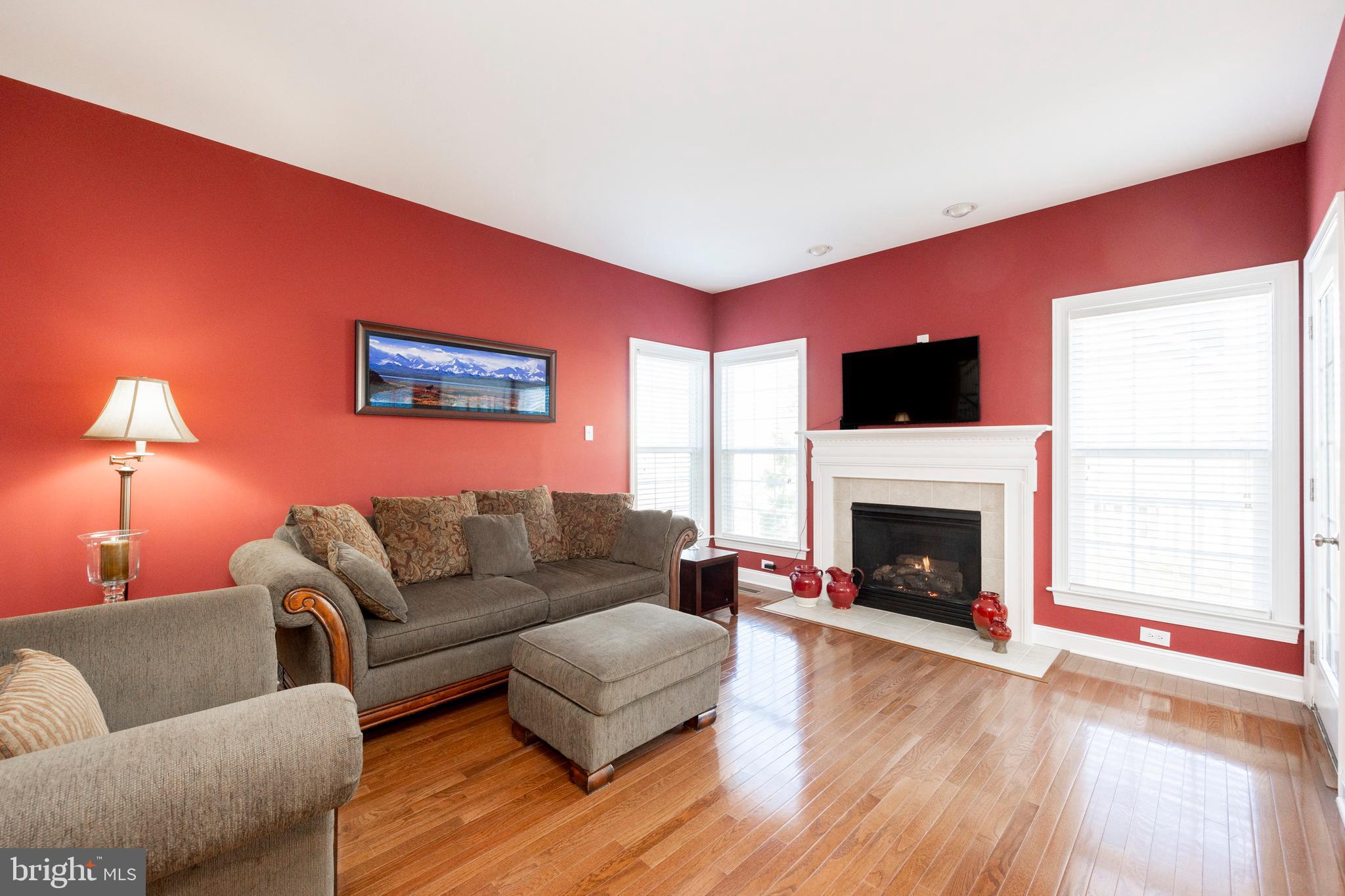 29 Ashtree Lane Malvern, PA 19355 - Photo 13 of 39 a living room with furniture flat screen tv and a fireplace