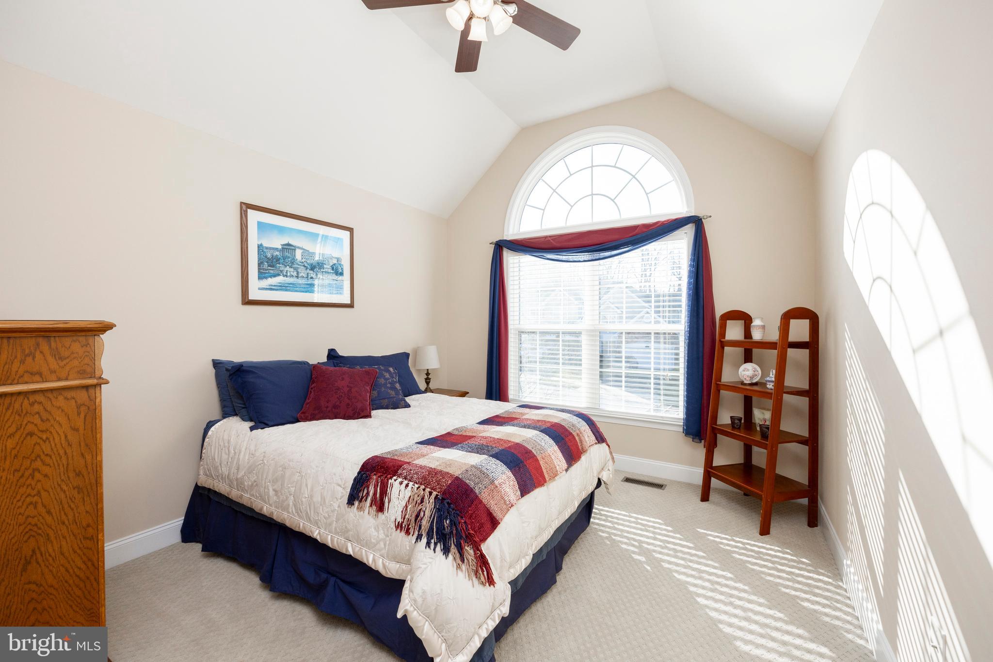 29 Ashtree Lane Malvern, PA 19355 - Photo 21 of 39 a bedroom with a bed and a large window