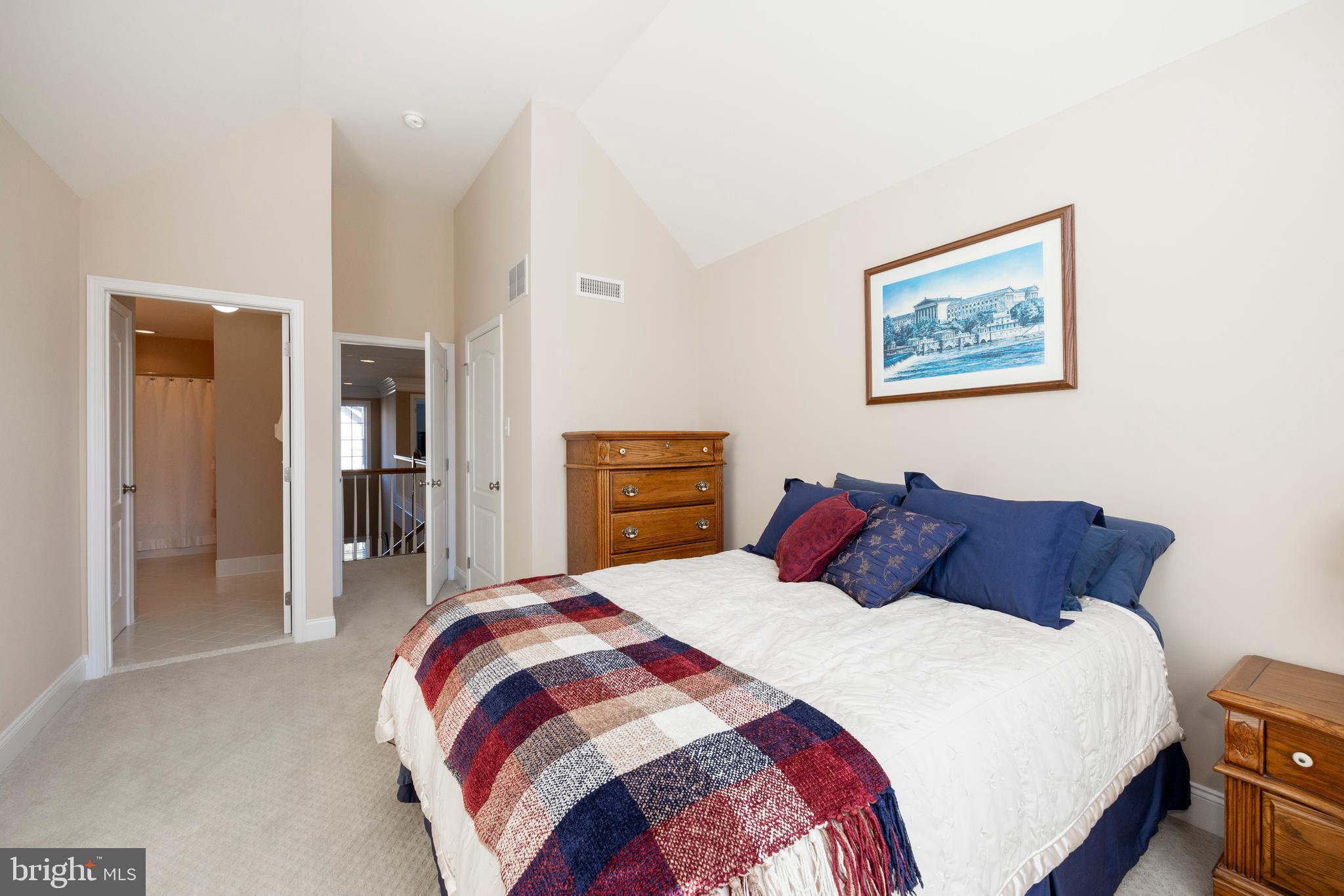29 Ashtree Lane Malvern, PA 19355 - Photo 22 of 39 a bedroom with a large bed and a painting on the wall