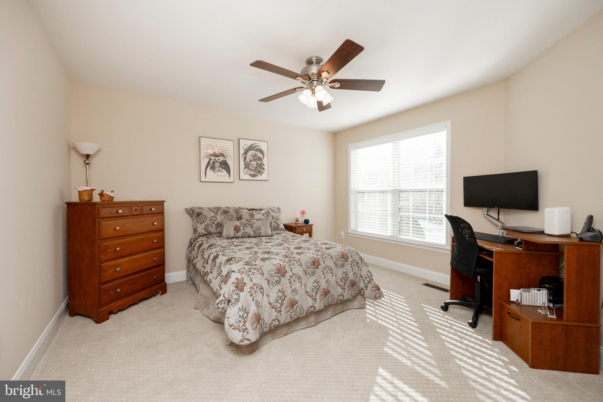29 Ashtree Lane Malvern, PA 19355 - Photo 24 of 39 a bedroom with a bed and a flat screen tv
