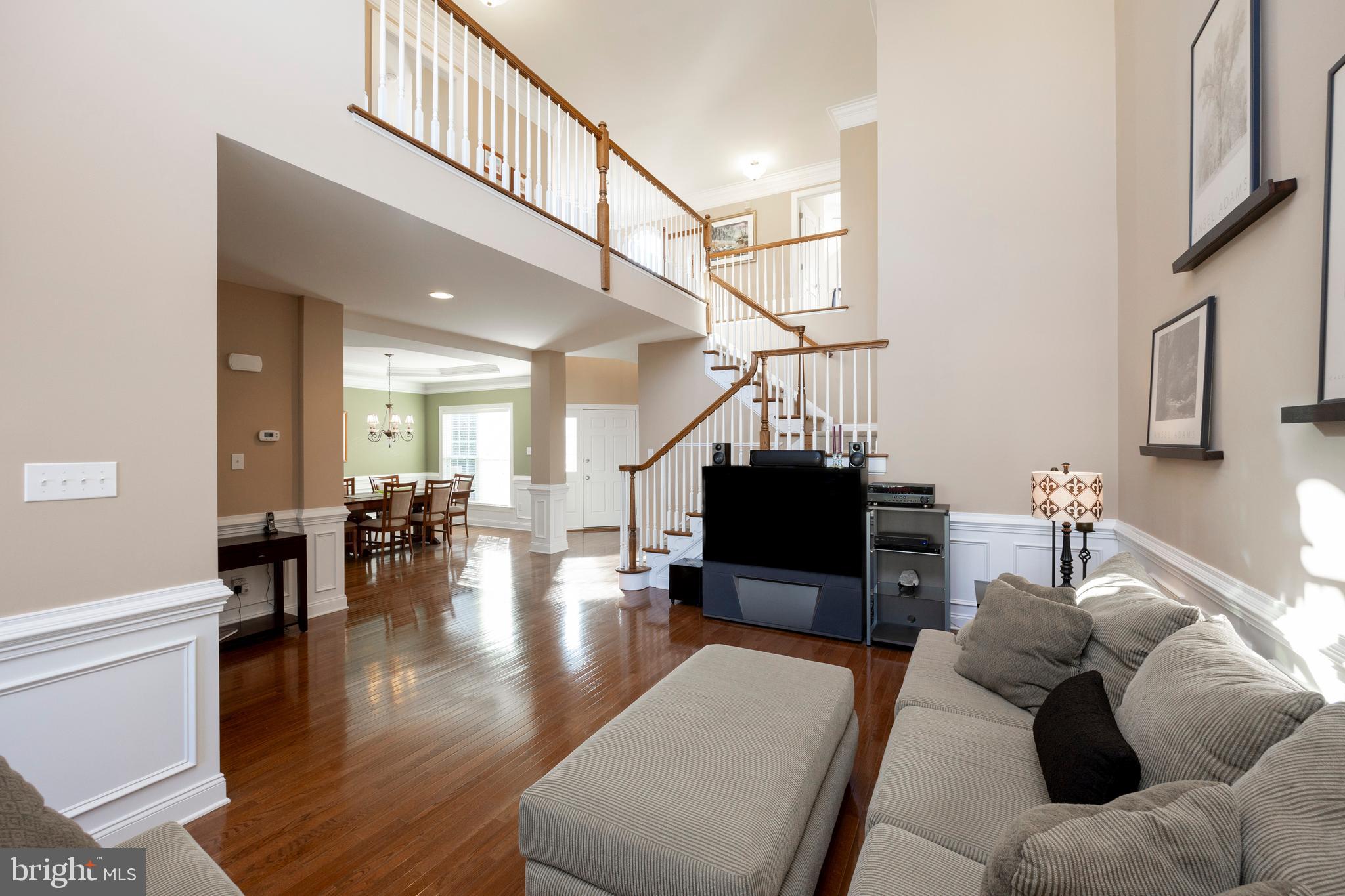 29 Ashtree Lane Malvern, PA 19355 - Photo 9 of 39 a living room with furniture and a chandelier