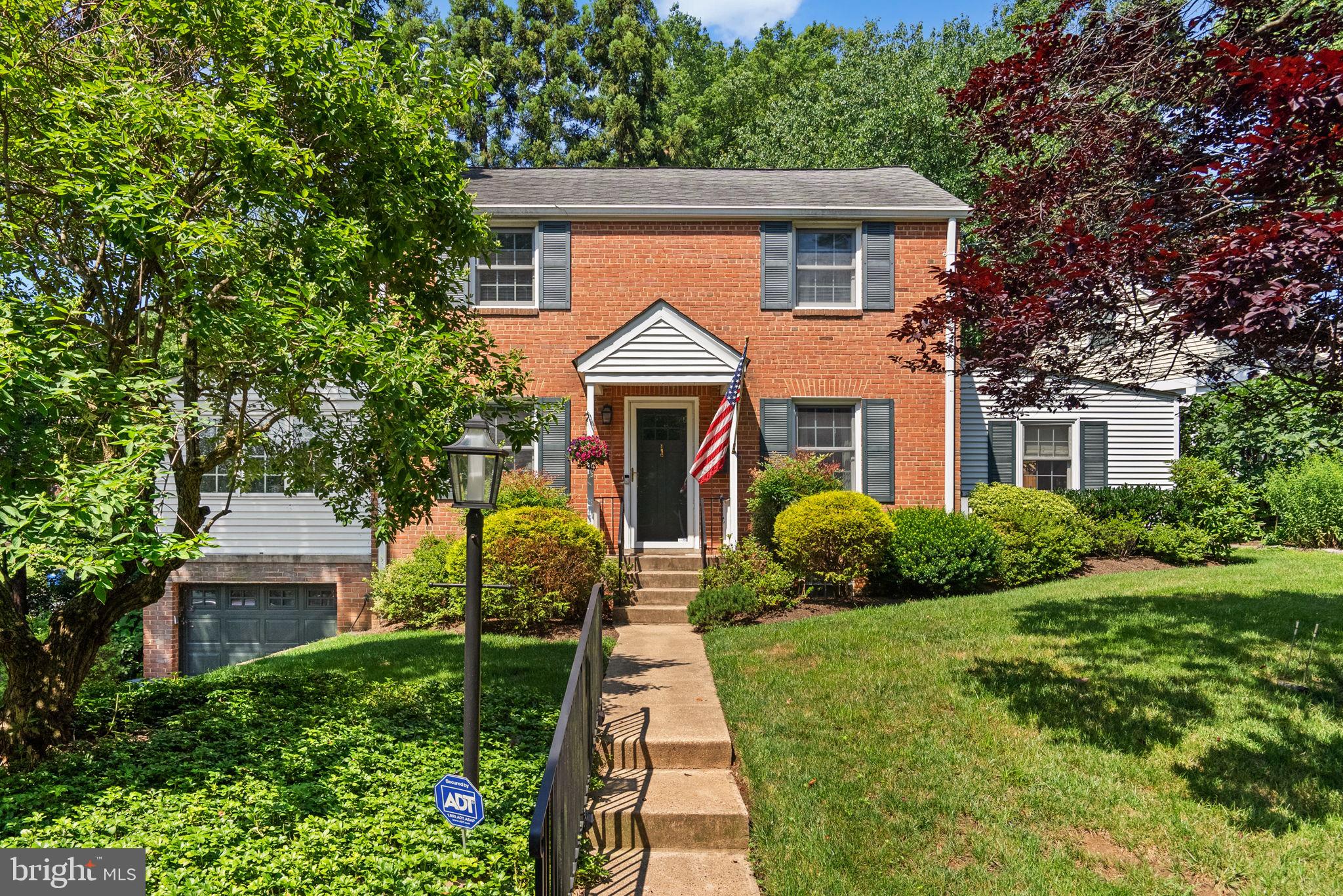 129 Lynnmoor Drive Silver Spring, MD 20901 - Photo 1 of 48 a front view of a house with a yard and potted plants