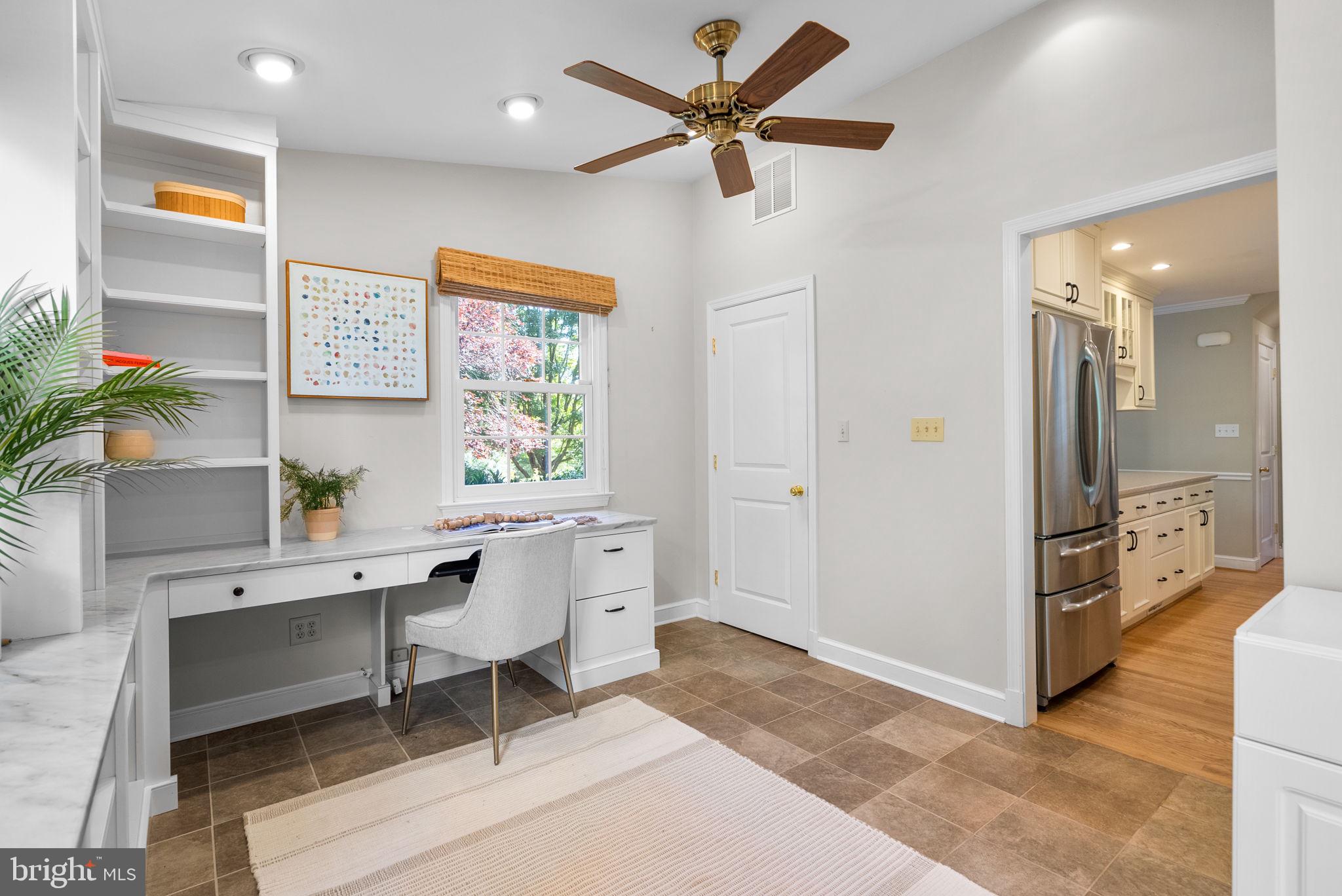 129 Lynnmoor Drive Silver Spring, MD 20901 - Photo 20 of 48 a view of a workspace with furniture and a window