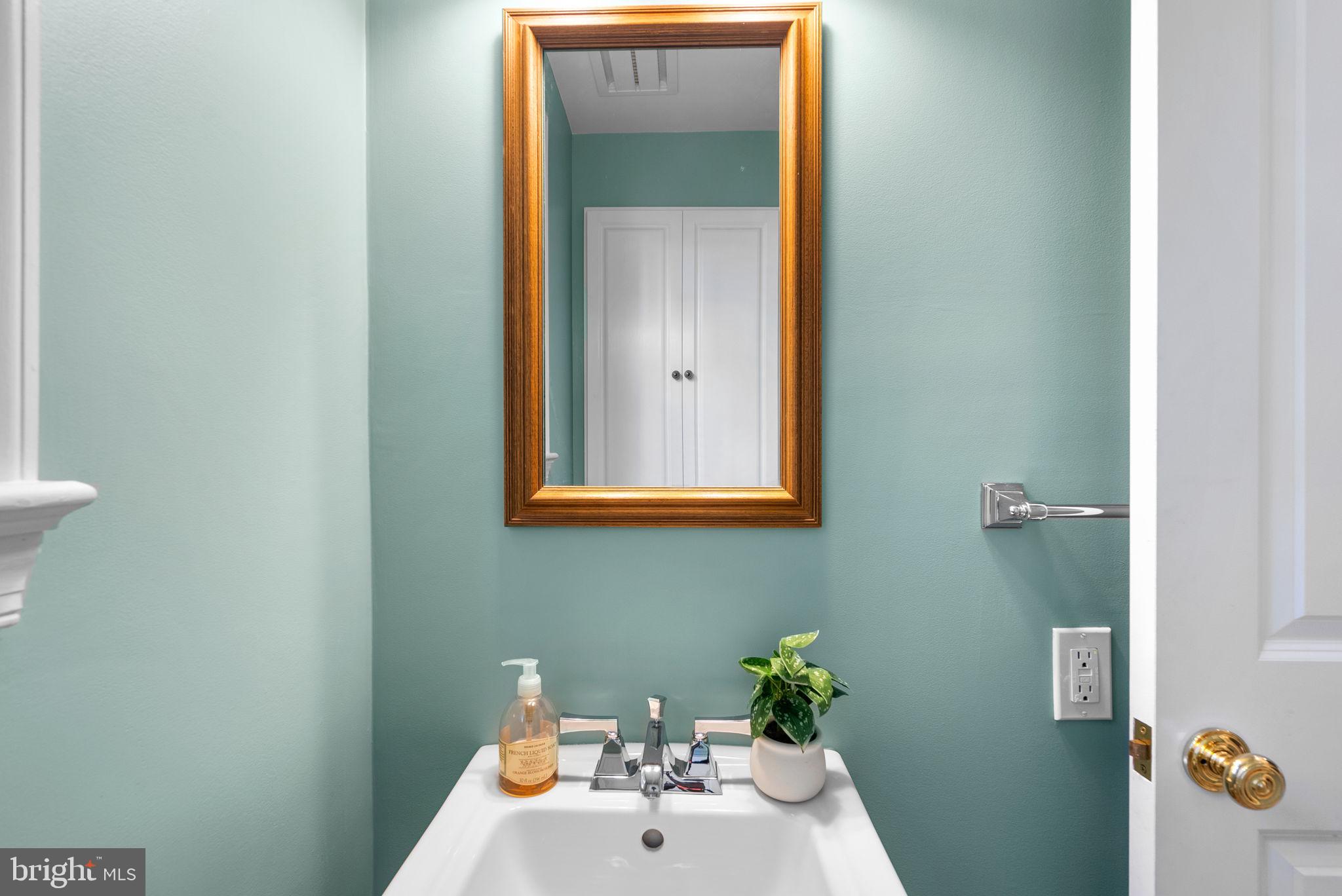 129 Lynnmoor Drive Silver Spring, MD 20901 - Photo 23 of 48 a bathroom with a sink and mirror