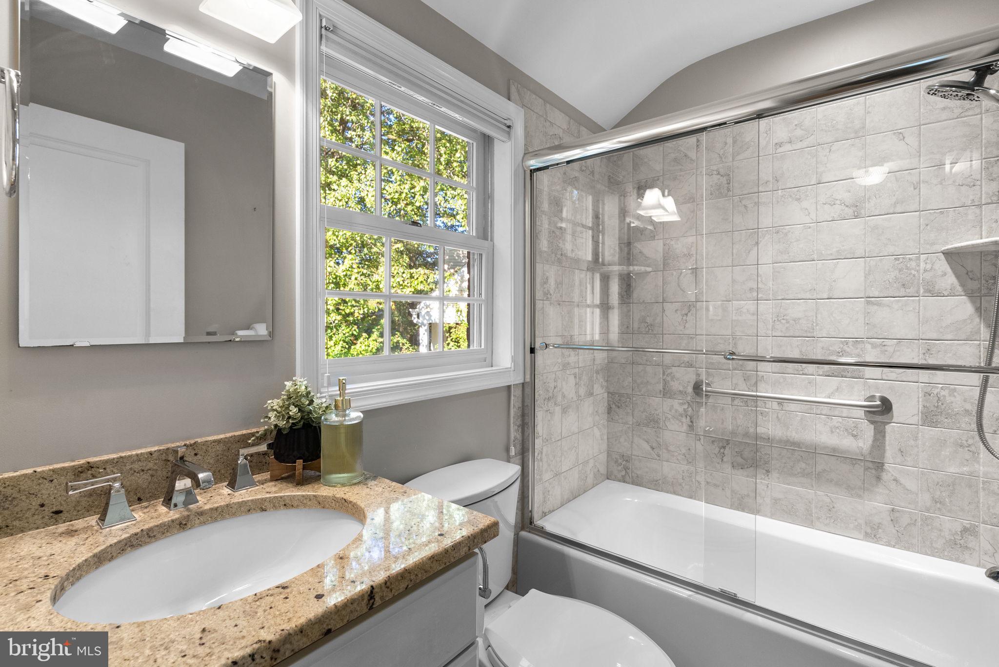 129 Lynnmoor Drive Silver Spring, MD 20901 - Photo 28 of 48 a bathroom with a granite countertop sink toilet and bathtub