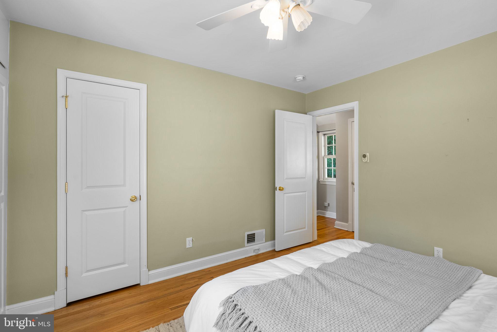 129 Lynnmoor Drive Silver Spring, MD 20901 - Photo 30 of 48 a bedroom with a bed and wooden floor