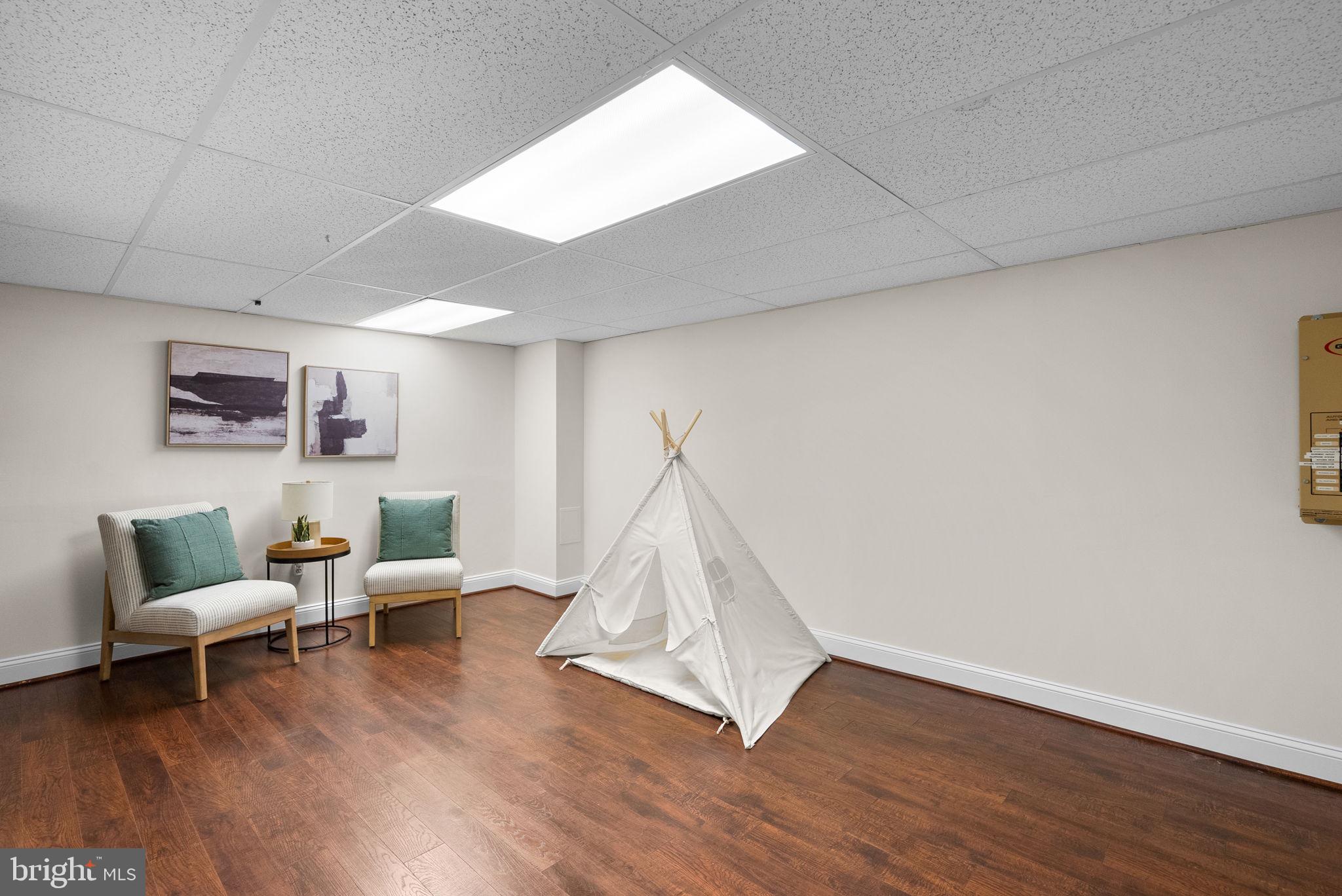 129 Lynnmoor Drive Silver Spring, MD 20901 - Photo 31 of 48 a living room with furniture and a wooden floor