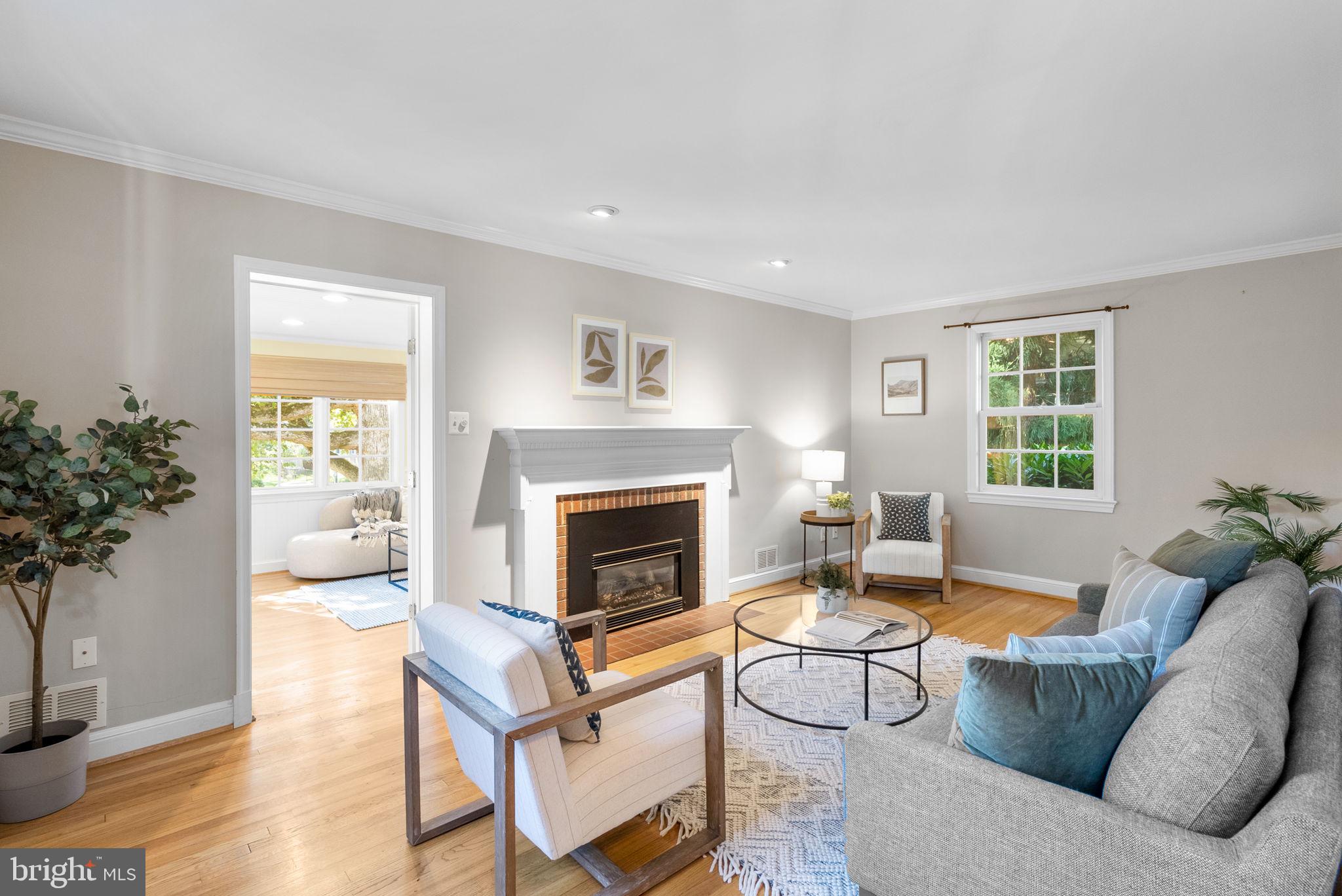129 Lynnmoor Drive Silver Spring, MD 20901 - Photo 5 of 48 a living room with furniture a window and a fireplace