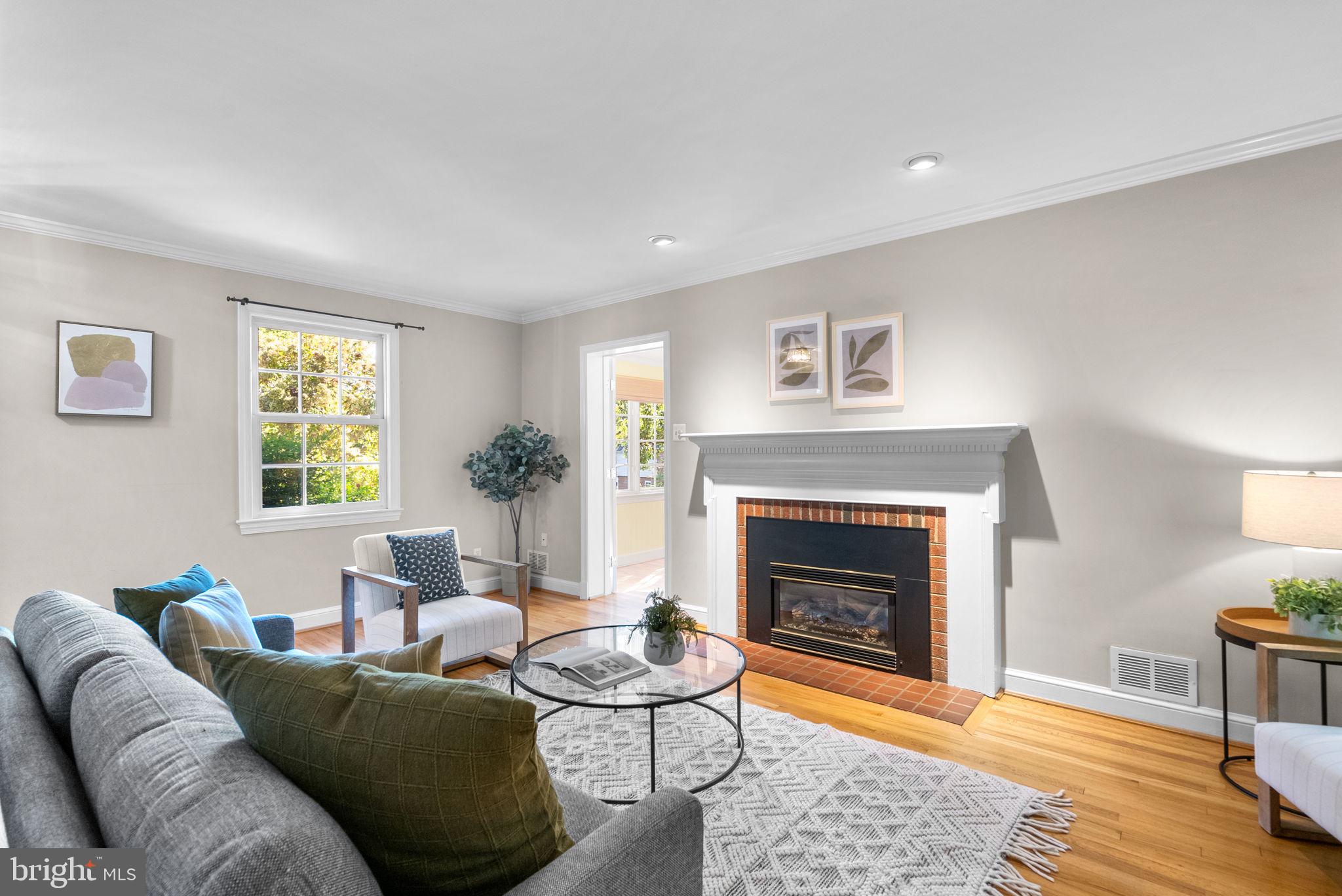 129 Lynnmoor Drive Silver Spring, MD 20901 - Photo 7 of 48 a living room with furniture and a fireplace
