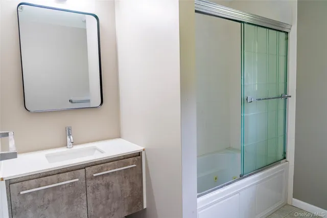 a bathroom with a sink and a mirror