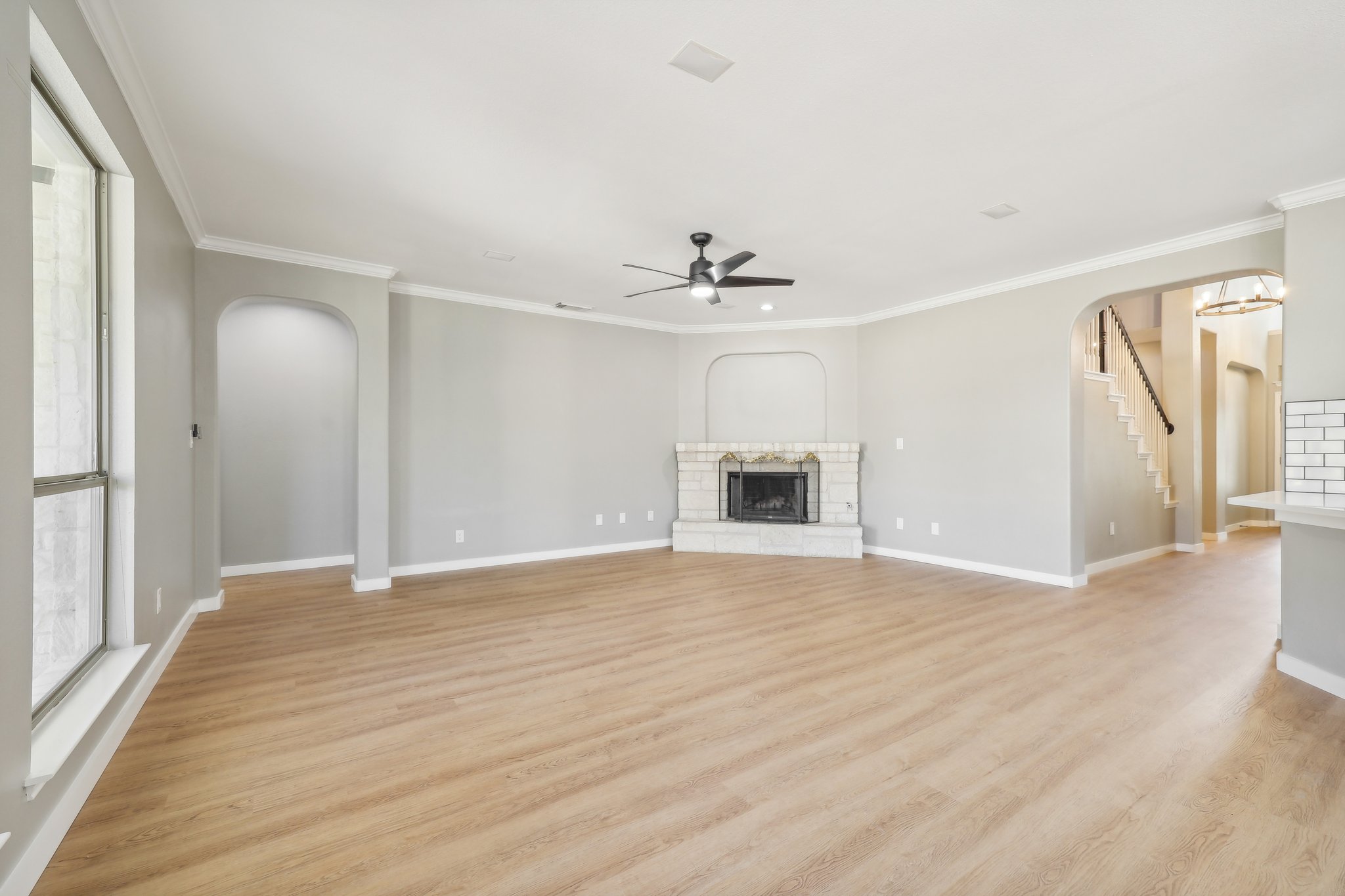 7324 Moon Rock Road Austin, TX 78739 - Photo 6 of 30 a view of empty room with wooden floor and ceiling fan