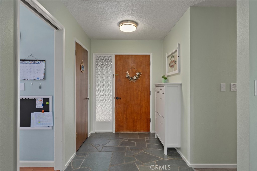 16298 Forest Ranch Road Forest Ranch, CA 95942 - Photo 14 of 67 a view of a hallway with wooden shelves