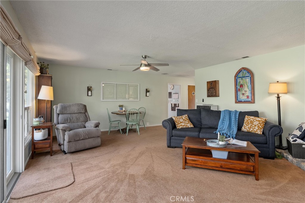 16298 Forest Ranch Road Forest Ranch, CA 95942 - Photo 17 of 67 a living room with furniture and a large window