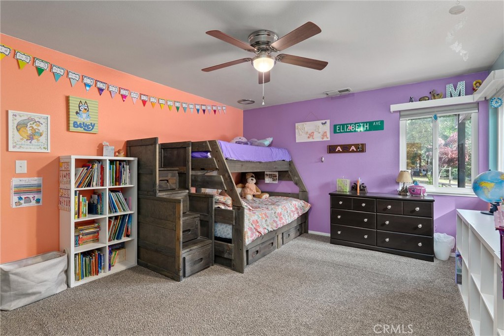16298 Forest Ranch Road Forest Ranch, CA 95942 - Photo 32 of 67 a bedroom with a bed and a cabinets
