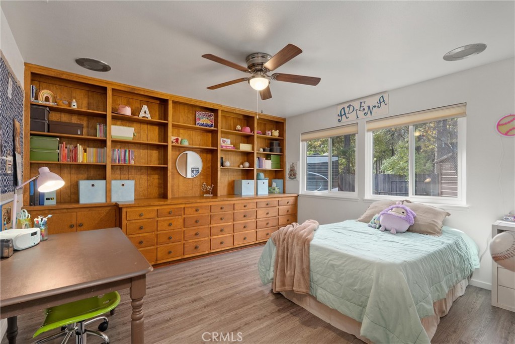16298 Forest Ranch Road Forest Ranch, CA 95942 - Photo 35 of 67 a bedroom with a large bed and a chandelier