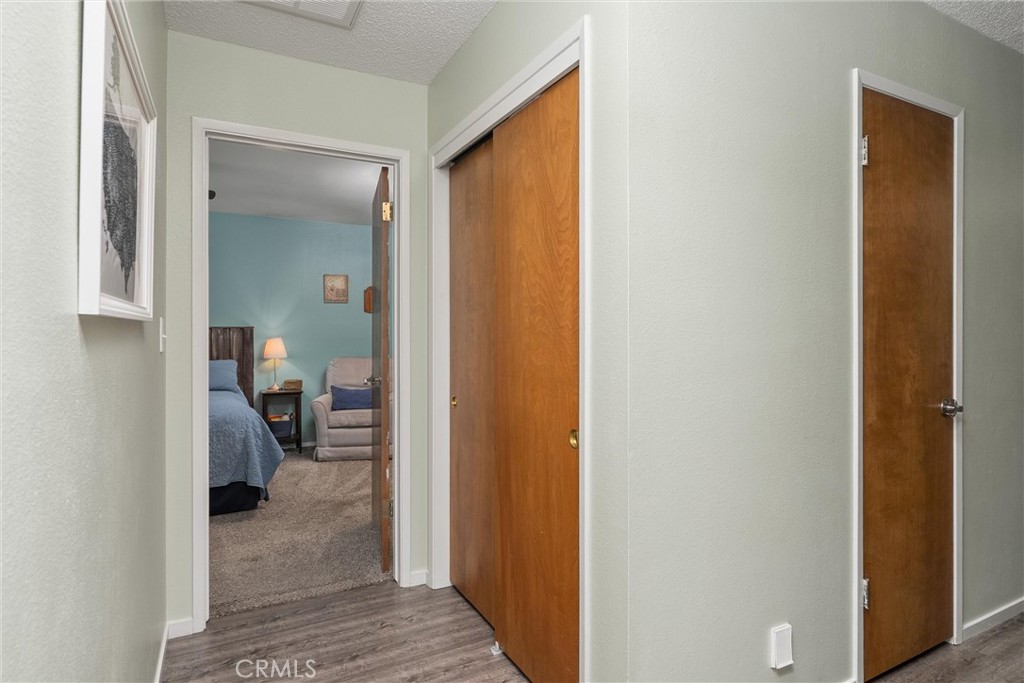 16298 Forest Ranch Road Forest Ranch, CA 95942 - Photo 37 of 67 a view of a hallway with a livingroom and a bathroom