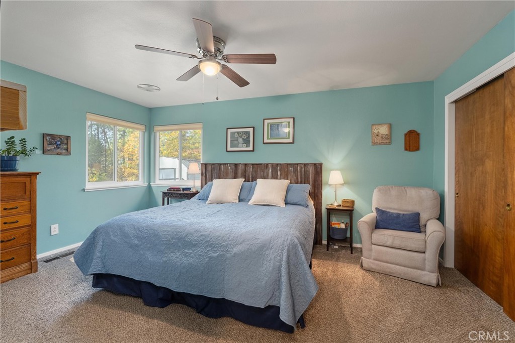 16298 Forest Ranch Road Forest Ranch, CA 95942 - Photo 38 of 67 a bedroom with a bed couch and window