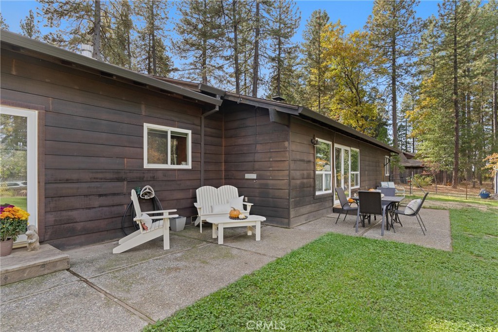 16298 Forest Ranch Road Forest Ranch, CA 95942 - Photo 42 of 67 a backyard of a house with outdoor seating