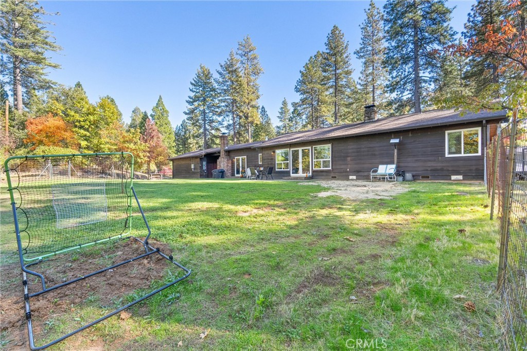 16298 Forest Ranch Road Forest Ranch, CA 95942 - Photo 56 of 67 a backyard of a house with lots of green space and fountain