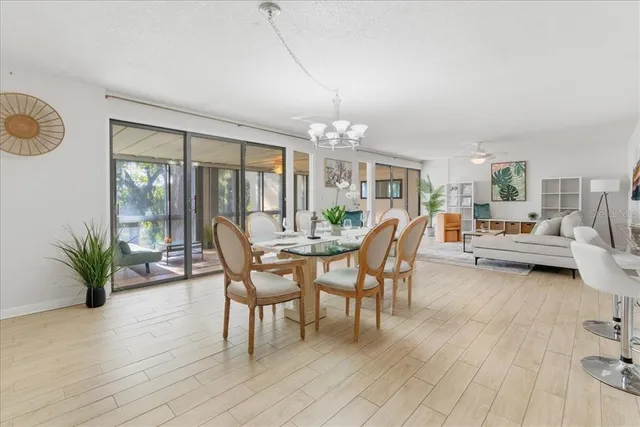 a view of a room with furniture and wooden floor