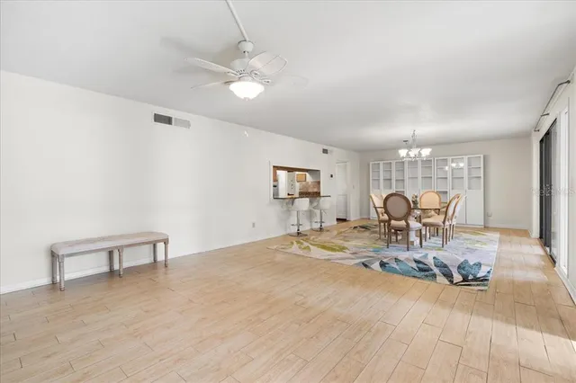 a view of a livingroom with furniture window and wooden floor
