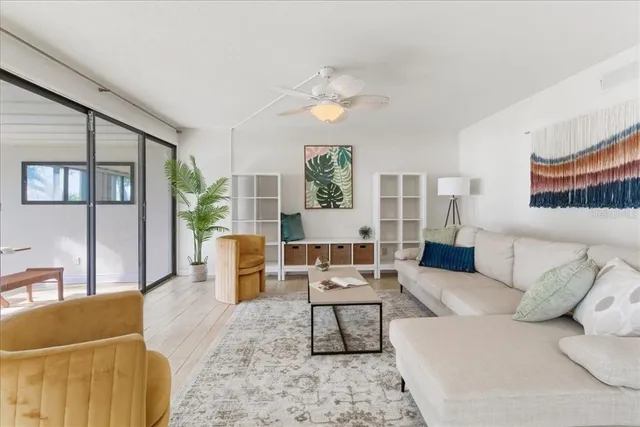 a kitchen with stainless steel appliances granite countertop a sink and cabinets with wooden floor