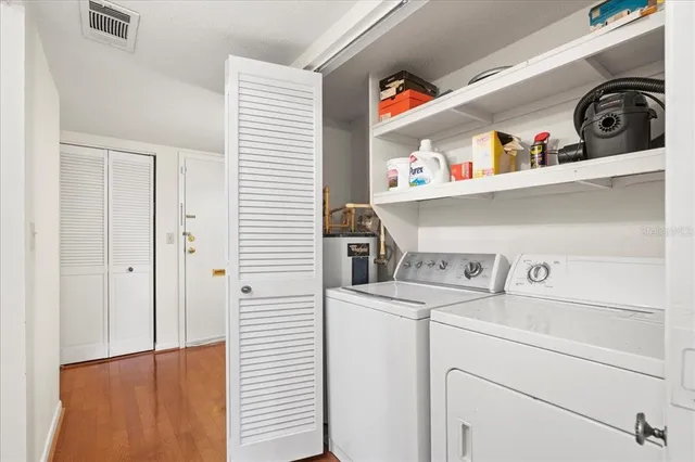 a bedroom with a bed and a table