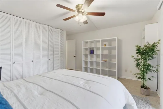 a bedroom with a bed and window