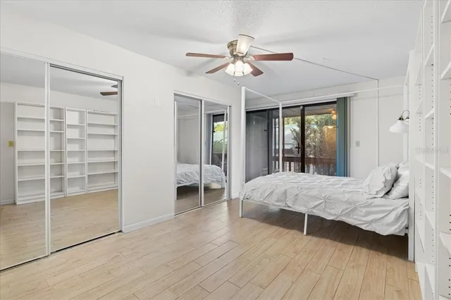 a bedroom with a bed and a television