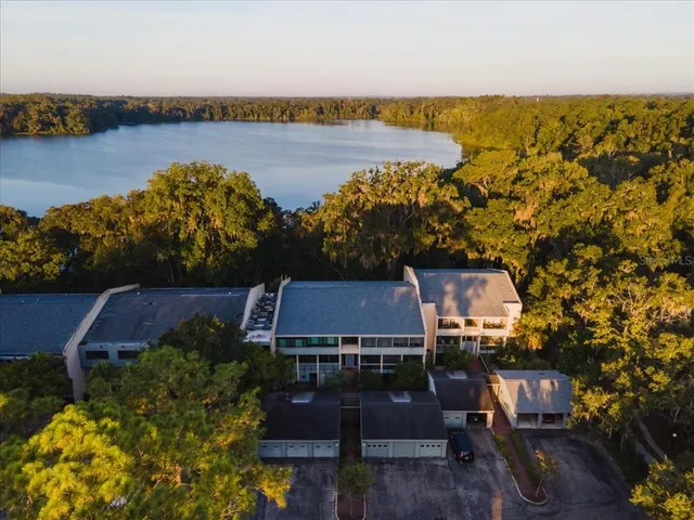 an aerial view of houses with yard