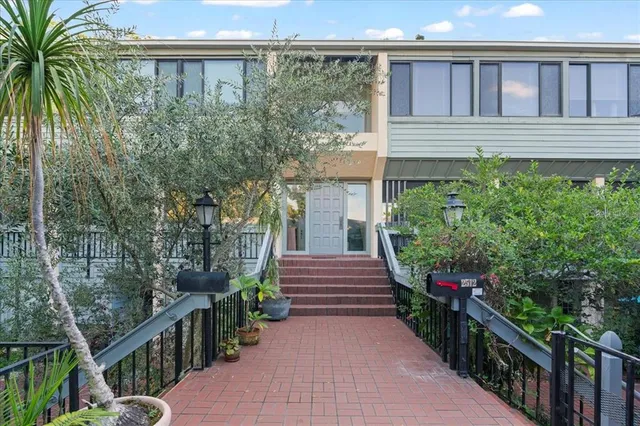 front view of a house with a garden