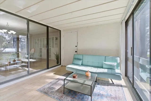 a living room with furniture a red couch and a fireplace