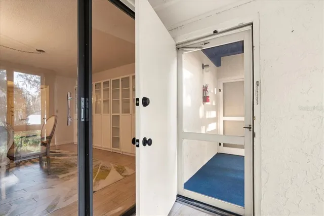 an aerial view of a house with a yard and trees