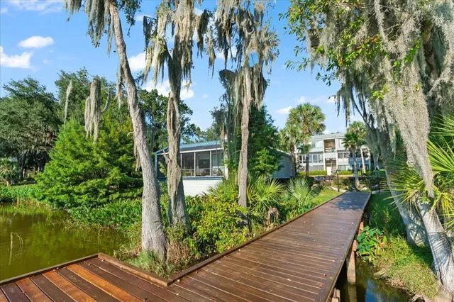 a aerial view of a house with a yard and a fountain
