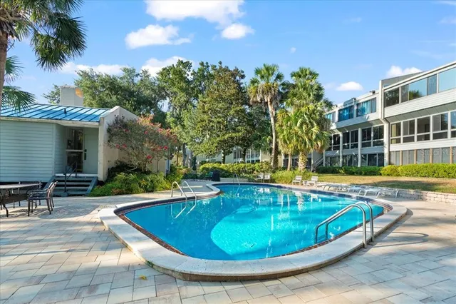 a view of a house with a lake and a mountain view