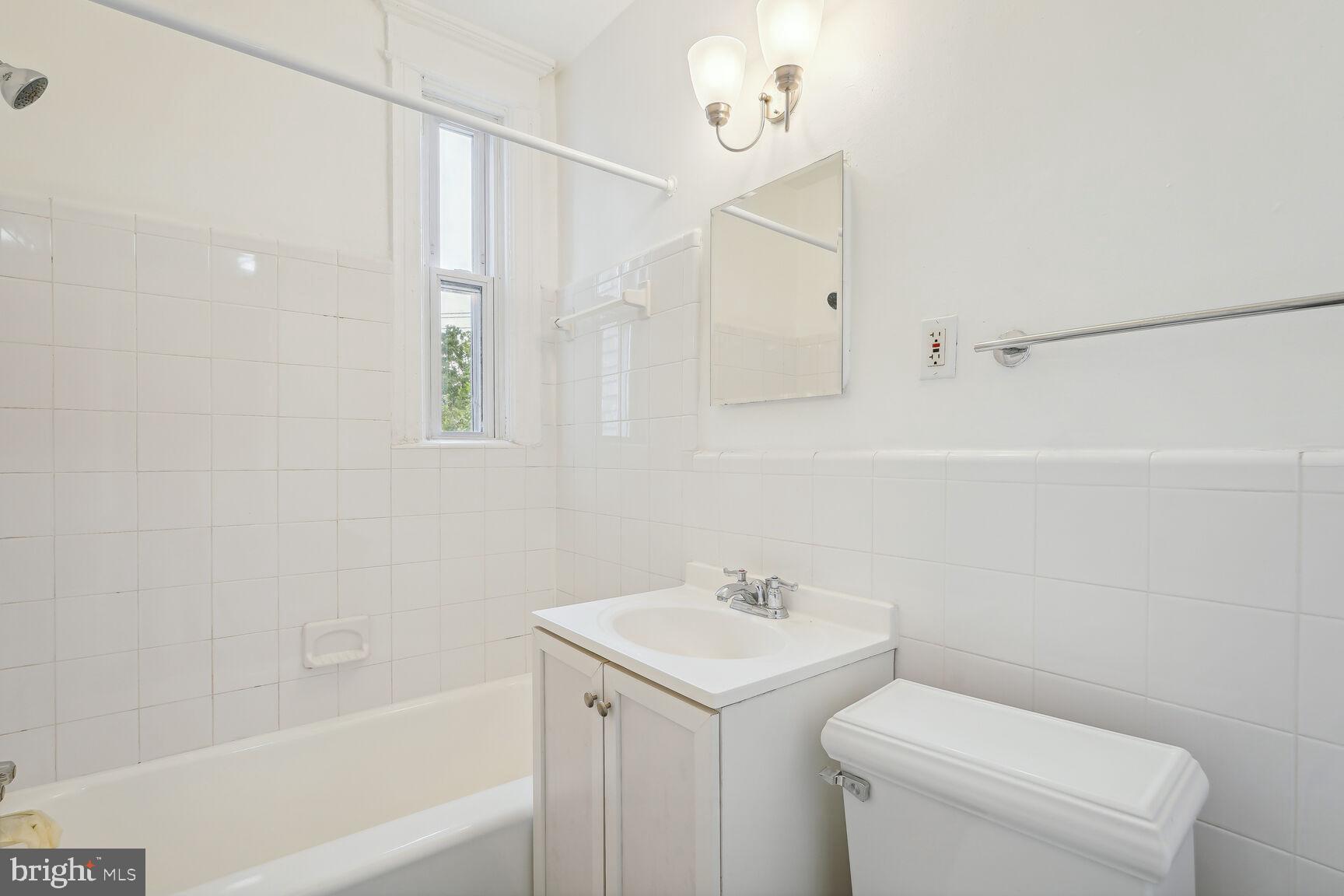 4528 4th Street Northwest Washington, DC 20011 - Photo 20 of 28 a bathroom with a sink a toilet and shower