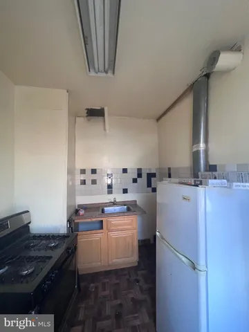 a kitchen with a sink and a stove