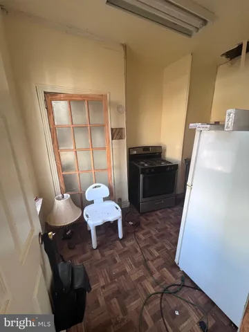 a kitchen with a sink and wooden cabinets