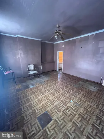 a view of a livingroom with furniture nad wooden floor