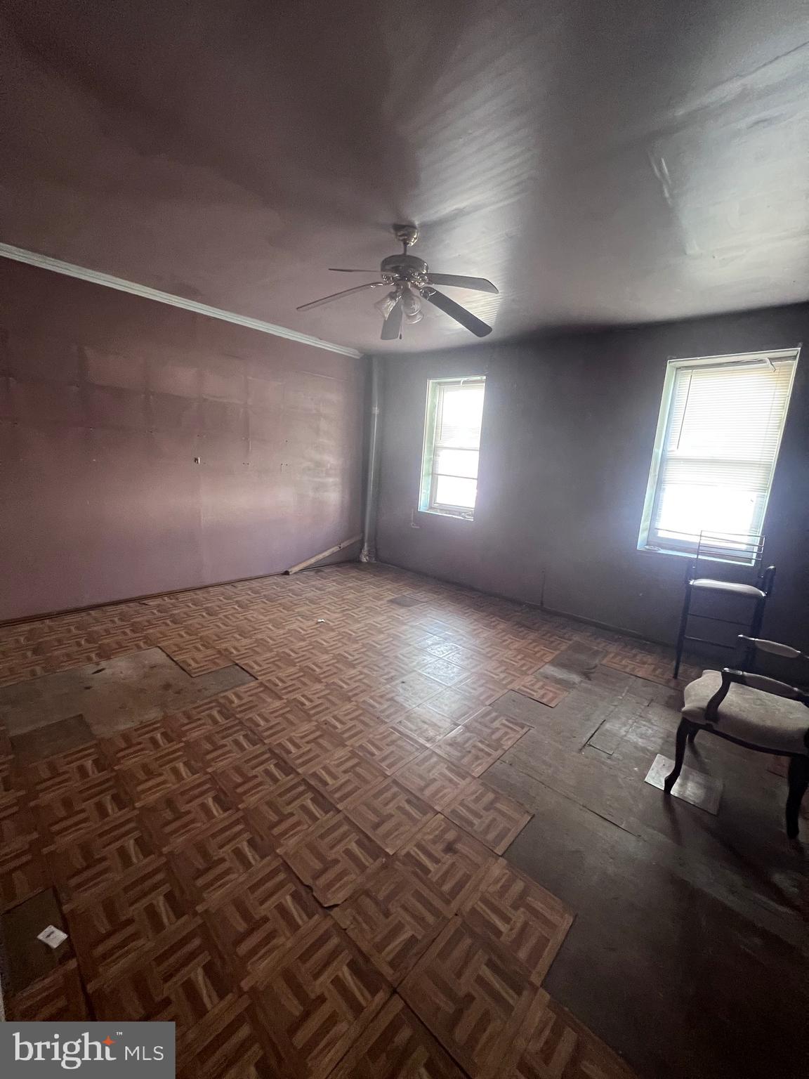 861 Perkiomen Street Philadelphia, PA 19130 - Photo 22 of 35 an empty room with windows and ceiling fan