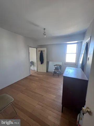 a bed room with a bed and mirror