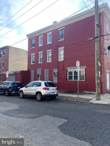 a view of street with parked cars